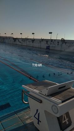 an empty swimming pool is shown with the sun shining on it's surface and blue water