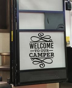 there is a sign that says welcome to our camper