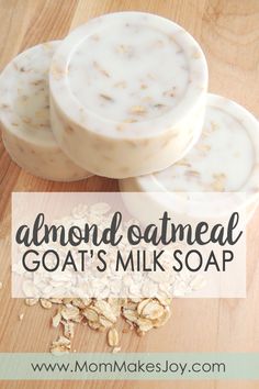 three soap bars sitting on top of a wooden table next to oatmeal