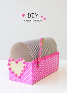 a pink and white box with hearts on it