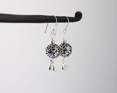 "Oxidized and shiny textured Turkish sterling silver balls are accented with coordinating silver drop charms which dangle from the bottom. Paired with sterling silver ear wires. These earrings are sweet and casual. Perfect for every day wear. Total length from the top of the ear wires to the bottom of the drops measures 1 1/2\". Sterling silver is .925 pure silver. Turkish silver is .925 pure silver. Check out other items in my shop here: https://www.etsy.com/shop/LindseySilberman" Sterling Silver Teardrop Earrings With Silver Beads, Silver Long Drop Earrings With Dangling Charms, Silver Teardrop Earrings With Dangling Charms, Sterling Silver Teardrop Earrings With Dangling Beads For Gifts, Silver Sterling Silver Earrings With Dangling Beads, Sterling Silver Teardrop Earrings With Dangling Beads, Gift Teardrop Earrings With Dangling Beads In Sterling Silver, Gift Sterling Silver Teardrop Earrings With Dangling Beads, Silver Teardrop Earrings With Dangling Beads For Gift