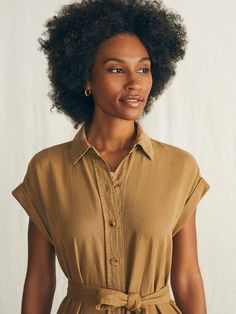 A classic shirt dress is one of our unsung wardrobe heroes. Inspired by utilitarian style, this one is made for the everyday with the same soft, just-stretchy-enough fabric of our fan favorite Arlie Day Pant. Specially dyed and washed for a vintage-inspired, lived-in vibe, we designed it with rolled cuffs, patch pockets, and cinched tie for that casually cool vibe that takes you from afternoon errands to dining alfresco. Fit: Relaxed fit. Length: 49 3/4" Detail: Horn button closure with removable self belt and on seam pockets. Material: 55% TENCEL™ Lyocell, 22% Linen, 21% Organic Cotton, 2% Elastane, Faux Horn Urea Buttons Model: Gabrielle is 5’9 wearing size Small Care: Machine wash cold. Remove promptly. Tumble dry low. Warm iron if needed. WDU2416-ABZ Utilitarian Style, Classic Shirt Dress, Swim Pants, Stylish Clothes For Women, Linen Shop, Dress Shirts For Women, Sweater Sale, Shirtdress, Ulla Johnson