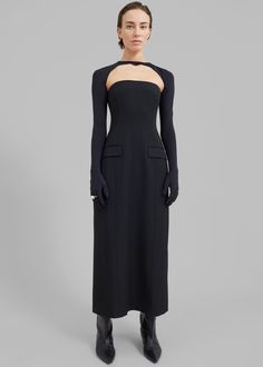 Color: Black Midweight woven fabric Slim fit Midi length Strapless Front flap pockets Back slit Concealed back zip closure Unlined 68% Polyester 29% Viscose 3% Elastane Machine Wash Warm By Beaufille. Made in Portugal Formal Wedding Attire, Bolero Top, Anna October, The Frankie Shop, Frankie Shop, Paris Woman, Column Dress, Tailored Dress, White Shirt Dress