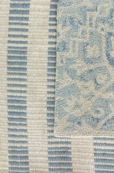 a close up view of a blue and white rug