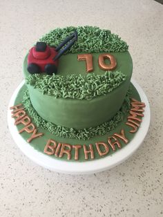 a green birthday cake with a tractor on top