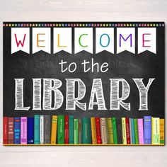 welcome to the library sign with colorful books on blackboard in front of white wall