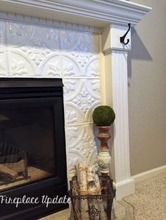 a fireplace with a potted plant on the mantle