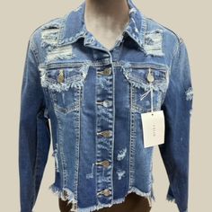 Cello Distressed Blue Denim Jean Jacket With A Button Up Front, Frayed Cuffs And Hemline. New W/Tags, In Excellent Condition. Available In Small, Medium, Large. Measurements: Small: Medium: Large: Chest: 32.5" 33" 34" Waist: 37" 39.5" 40" Length Of Garment: 18" 19.5" 19.5" Armhole: 19" 19" 20.5" Sleeves: 20" 21" Denim Blue Button-up Jacket With Frayed Hem, Spring Blue Denim Jacket With Frayed Hem, Blue Denim Jacket With Frayed Hem For Spring, Blue Distressed Button-up Outerwear, Blue Denim Jacket With Button Closure For Spring, Blue Denim Jacket With Buttons For Spring, Blue Denim Jacket For Spring With Buttons, Spring Blue Denim Jacket With Buttons, Blue Denim Jacket For Spring