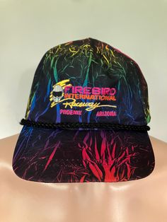 True vintage Firebird Internarional Raceway black rainbow snapback hat from the 90s. Black with rainbow swirl nylon cap, excellent shape, light wear, thoroughly cleaned, OSFA. Retro Multicolor Snapback Baseball Cap, Retro Multicolor Snapback Hat, Multicolor Trucker Hat For Streetwear, Multicolor Flat Bill Trucker Hat For Streetwear, Multicolor Flat Brim Trucker Hat For Streetwear, Vintage Snapback, Snapback Caps, Black Rainbow, Rainbow Swirl