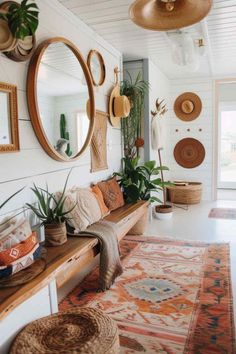 a living room filled with lots of furniture and plants on top of a wooden bench