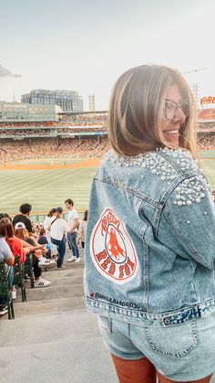 *Please note all jacket orders take two weeks processing time* Custom hand painted and hand lettered denim jacket with your choice of sports team or business logo! Adorned with pearl and rhinestone accents across the upper shoulder/back area, This design is painted on the back side of the jacket using acrylic fabric paint so we recommend hand washing ONLY if needed because of it’s delicate nature. If you are washing in a machine, spray lettering with Scotch Guard and wash inside out on HAND WASH Astros Jacket, Jean Patches, Jean Jacket Design, Volleyball Apparel, Disney 2025, Creative Clothing, Embroidered Jean Jacket, Painted Denim Jacket