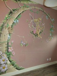 a wall painted with flowers and fairy tinkerbells on the tree branch, in a child's bedroom