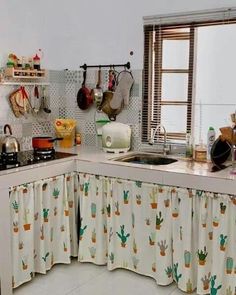 a kitchen with pots and pans hanging on the wall