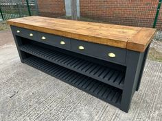 a kitchen island made out of an old cabinet with drawers and knobs on the top