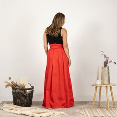 Indulge in timeless sophistication with our maxi cotton skirt, meticulously designed for both comfort and style. This high-waisted masterpiece boasts a gracefully tied bow on the waist, adding a touch of feminine allure. Available in a variety of colors, this skirt is a chic and versatile addition to your wardrobe, effortlessly blending fashion-forward trends with a classic silhouette.  Enjoy the effortless fit and the feminine sense when wearing our creations! Every piece by NikkaPlace is made Elegant Pleated Full Skirt Maxi Dress, Elegant Maxi Dress With Pleated Full Skirt, Formal Red Flowy Maxi Skirt, Elegant Floor-length Voluminous Maxi Skirt, Elegant Red Gathered Skirt, Elegant Voluminous Floor-length Maxi Skirt, Chic Voluminous Floor-length Skirt, Floor-length Lined Maxi Skirt For Gala, Elegant Full Skirt Maxi Dress With Lined Skirt