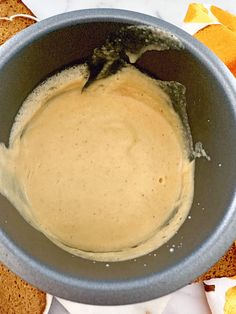 a bowl filled with batter sitting on top of a table