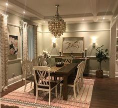 a dinning room table with chairs and rug