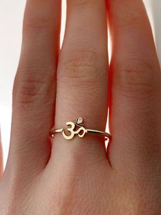 Om Gold Rings For Women, Symbolic Adjustable Promise Jewelry, Spiritual Diamond Jewelry With Gemstones, Symbolic Promise Jewelry With Polished Finish, Symbolic Diamond Jewelry With Gemstones, Symbolic Sterling Silver Promise Jewelry, Symbolic Brass Jewelry For Anniversary, Symbolic Rose Gold Promise Jewelry, Spiritual Gold Plated Jewelry With Polished Finish