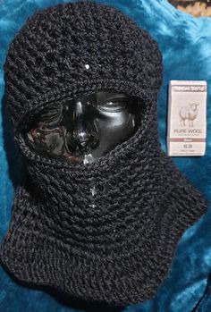 This is a medium to large, unisex, hand crocheted ski mask or balaclava made in 100% black pure wool. Perfect to keep your head warm and be stylish in winter.  Made with Pure Wool premium New Zealand 100% wool in a jet black.  Please note there may be variations in the actual colour due to photography.  The balaclava measures approximately 35cm (14inches) in length x 56cm (22inches) around. Sized to fit medium to large Adult. There is stretch due to the design. This is pure wool so cool hand was Fitted Full Face Black Balaclava, Black Fitted Full Face Balaclava, Black Warm Full Face Balaclava, Warm Black Full Face Balaclava, Black Balaclava For Cold Weather And Winter, Black Balaclava For Cold Winter Weather, Black Balaclava For Cold Weather, Warm Black Balaclava For Cold Weather, Black Full Face Balaclava For Cold Weather