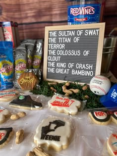 some cookies and snacks are on a table with a sign that says, the suitian of swat