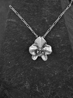 "This solid 3 Dimensional Original Phalanopsis Orchid is Sterling Silver, The included chain is a Sterling Silver Figaro 50 chain. You may chose 16, 18 or 20 inch at the same price. Other length available at sightly higher prices. The Orchid pendant measures 1' tall by by 7/8\" across. I hand cast all my pieces using the lost wax casting method. Please ask your needs. You may call me with questions, often I am out so please use my machine. 831-476-3176. Satisfaction Guaranteed! I send items USPS Orchid Pendant, Orchid Necklace, Lost Things, Dinosaur Pendant, Lightning Bolt Earrings, The Orchid, Silver Heart Earrings, Dope Jewelry, Wax Casting