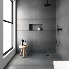 a white bath tub sitting next to a window