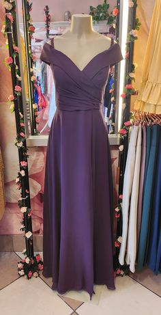 Indulge in the luxurious elegance of our Purple Low Shoulder Strap Dress. This A-line dress flatters with its feminine silhouette and adds a touch of sophistication to any occasion. Show off your stylish and exclusive taste. Shoulder Strap Dress, Senior Prom, Feminine Silhouette, Strap Dress, A Line Dress, Show Off, Shoulder Strap, Prom, Purple