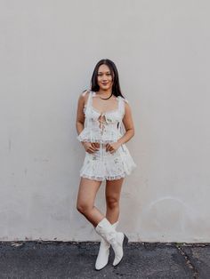 The ultra-feminine Kinsley broderie anglaise top will help awaken spring with its pink rosebud eyelets and lace trim. Pair this white lace top with the coordinating Kinsley mini skirt for the full, flirty look. Details Lined cups Functional rouleaux ties at center-front Functional shoulder strap ties Back smocking panel Mini godets along the flared hem Pair with Kinsley Mini Skirt Fabric + Care Self: 50%Polyester/ 50%Cotton; Lining: 100% Cotton Eco Dry Clean recommended. Avoid cleaners that use Flirty Lace Mini Dress For Spring, Spring Lace Mini Dress With Lace Top, Feminine Lace Trim Mini Dress For Spring, Flirty Spring Mini Dress With Lace Trim, Fitted Lace Trim Top For Garden Party, Feminine Spring Mini Dress With Lace Top, Feminine Lace Top Mini Dress For Spring, White Lace Trim Mini Dress, Summer Tops With Lace Trim And Mini Length