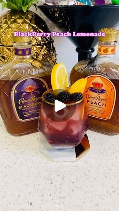 two bottles of blackberry peach lemonade sitting next to each other on a counter top