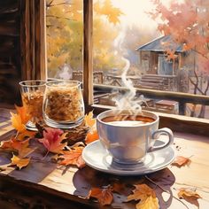 a cup of coffee sitting on top of a wooden table next to a window filled with autumn leaves