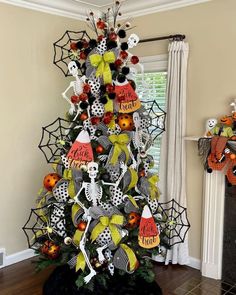 a decorated halloween tree in a living room