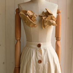 "This item is handmade in pure cotton fabric. Wonderful Italian fabric. Soft but firm hand. The skirt is made with small lateral folds both front and back. It has a short placket on the front, with a metal ciappa. Equipped with a 4 cm high corset, calculated for natural life. The placket with wooden buttons is fake. Finished internally, without lining. It is an elegant garment suitable for special occasions but also casual for use with flat shoes on a daily basis. Made of pure cotton fabric. Des Cotton Pleated Flared Maxi Skirt, Beige Relaxed Fit Cotton Maxi Skirt, Cotton Accordion Pleated Skirt Relaxed Fit, Cotton Accordion Pleated Skirt, Cotton Accordion Pleated Skirt In Relaxed Fit, Beige Pleated Cotton Maxi Skirt, Beige Cotton Pleated Maxi Skirt, Elegant Beige Cotton Maxi Skirt, Cotton Pleated Maxi Skirt