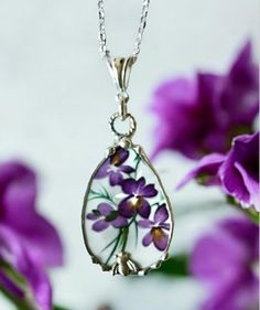 This charming necklace was handcrafted from broken Royal Grafton violet china, and recycled into a pendant. The pendant was decoratively soldered with a lead free silver alloy and suspended from a heavy sterling silver twisted jump ring and bail. You have the option of choosing the pendant only, a ready made 1.3mm cable sterling silver chain with a small lobster clasp, or a 2.3mm sterling silver oval long and short chain with clear crystals that I wrapped with sterling silver wire and a sterling Purple Jewelry With Natural Inclusions For A Gift, Flower Shaped Necklaces With Soldered Details For Gifts, Nature-inspired Purple Necklace For Gift, Vintage Lavender Jewelry For Gifts, Lavender Teardrop Pendant Jewelry Gift, Flower Shaped Soldered Necklaces For Gifts, Handmade Lavender Pendant Necklace, Sterling Silver Flower Pendant Necklace In Purple, Flower-shaped Soldered Necklaces For Gifts