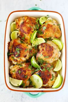 a casserole dish filled with chicken, potatoes and avocado wedges