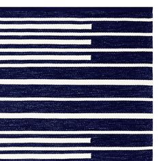 a blue and white area rug with horizontal lines on the bottom, one line in the middle