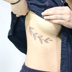 a woman with a tattoo on her stomach