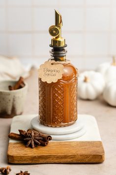 a bottle of cinnamon spice sitting on top of a cutting board