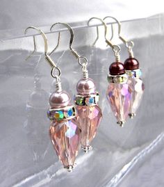 "These elegant sparkly pink earrings are made of rose crystal drops with Swarovski rhinestones and choice of 2 shades of mauve colored pearls. Beautiful rose colored crystals have a luster coating called thunder polish that is complimented by the rhinestone rondelles. A choice of rich mauve glass pearls OR pale mauve glass pearls tops them off - choose your selection at checkout. The earrings hang 1\" (2.5 cm) below the silver plated ear wires. These elegant earrings will add plenty of sparkle t Pearls Wedding, Tree Of Life Jewelry, Rose Crystal, Pearl Jewelry Wedding, Mauve Color, Unique Handmade Jewelry, Pearl Wedding, Pink Earrings, Crystal Drop