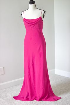 Turn heads with this stunning vintage Y2K hot pink floor-length dress, featuring an elegant cowl neckline. This dress combines bold color with timeless style, perfect for formal events, proms, or glamorous nights out. Embrace the captivating charm of early 2000s fashion with this vibrant and sophisticated piece. Add this breathtaking vintage gown to your collection for a show-stopping look and unforgettable elegance. Listed as a size 2. Message for measurements. Pink Bias Cut Maxi Dress For Gala, Pink Bias-cut Maxi Dress For Gala, Fitted Pink Maxi Dress With Bias Cut, Spring Formal Maxi Dress With Cowl Neck, Silk Cowl Neck Fitted Maxi Dress, Fitted Silk Maxi Dress With Cowl Neck, Fitted Cowl Neck Maxi Dress For Wedding, Pink Bias Cut Dress For Evening, Fitted Pink Silk Maxi Dress