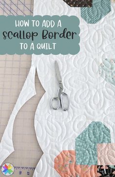 scissors are sitting on top of a piece of fabric with the words how to add a scallop border to a quilt