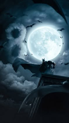 a batman standing on top of a building under a full moon with bats flying around