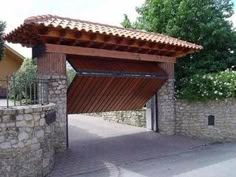 a stone wall with a wooden structure on it