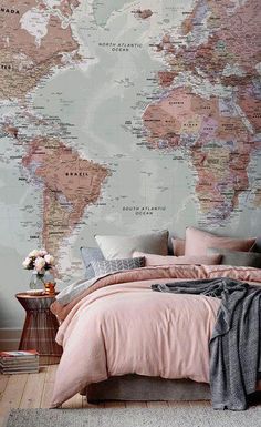 a bed room with a large map on the wall