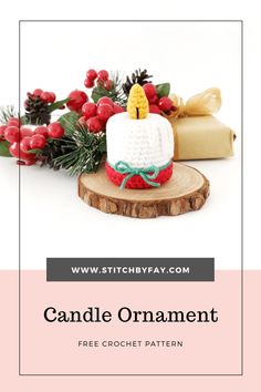 the candle ornament is made from crochet yarn and sits on a piece of wood