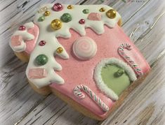 a close up of a decorated cookie on a wooden table