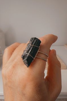 Introducing our exquisite handmade black tourmaline crystal rings, elegantly crafted with a gold band electroplating. Each ring is meticulously designed to be adjustable, ensuring a perfect fit for all sizes. Embrace the captivating beauty of black tourmaline, renowned for its protective energy and grounding properties. Elevate your style with a touch of mystique while enjoying the potential benefits that black tourmaline may bring to your life. Handmade and charged with positive intentions, the Positive Intentions, Protective Energy, Black Tourmaline Crystal, Ring Pictures, Tourmaline Crystal, Black Tourmaline, Raw Crystal, Crystal Rings, Gold Band