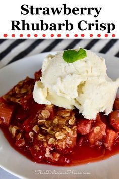 strawberry rhubarb crisp with ice cream on top and garnished with mint