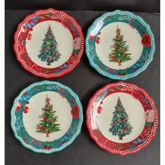 four plates with christmas tree designs on them