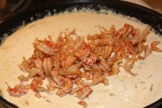 shrimp being cooked in a skillet on the stove