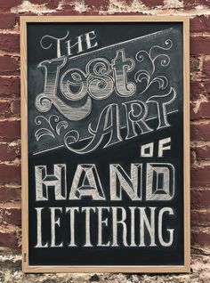 the lost art of hand lettering is displayed on a brick wall in an old - fashioned frame